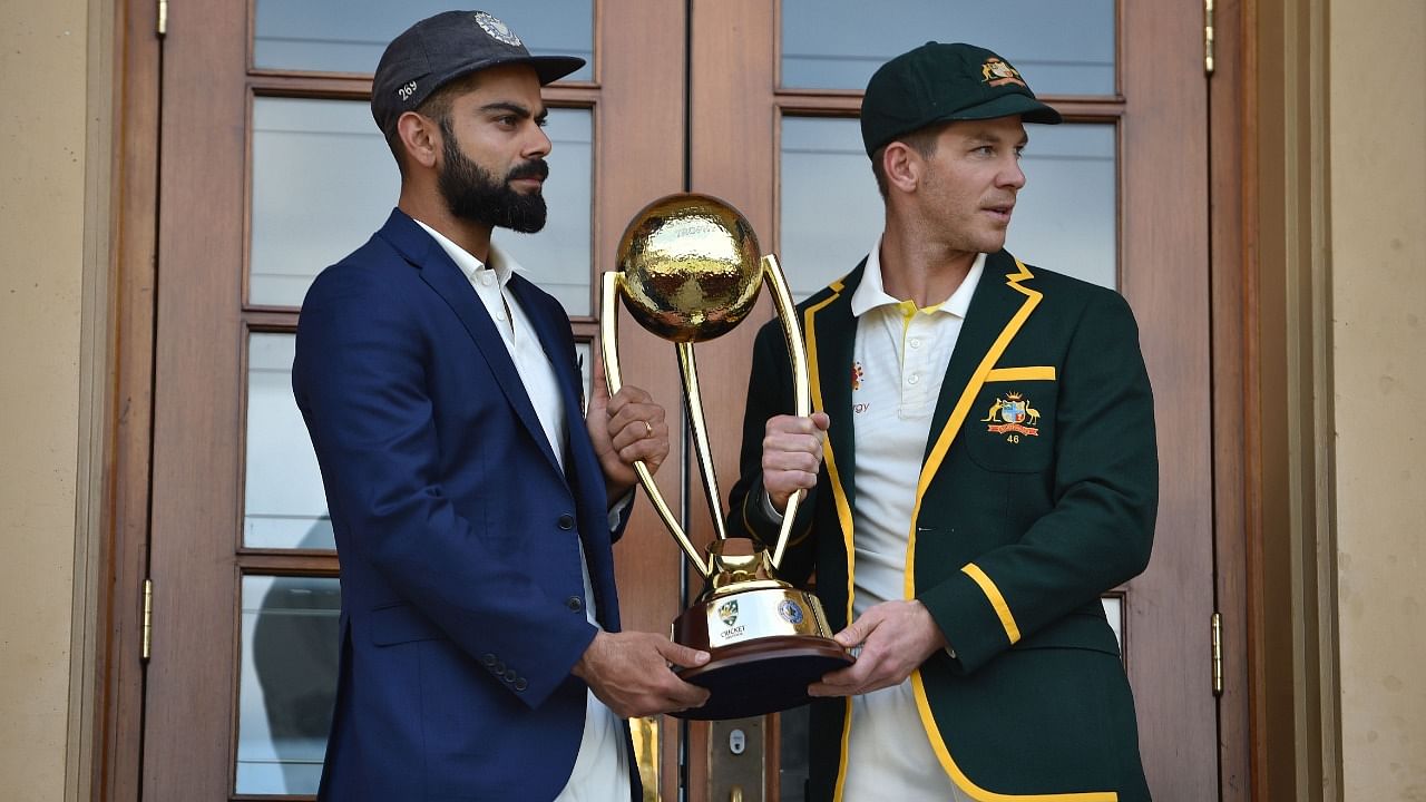 Australia cricket captain Tim Paine (R) and India cricket captain Virat Kohli (L). Credit: AFP File Photo