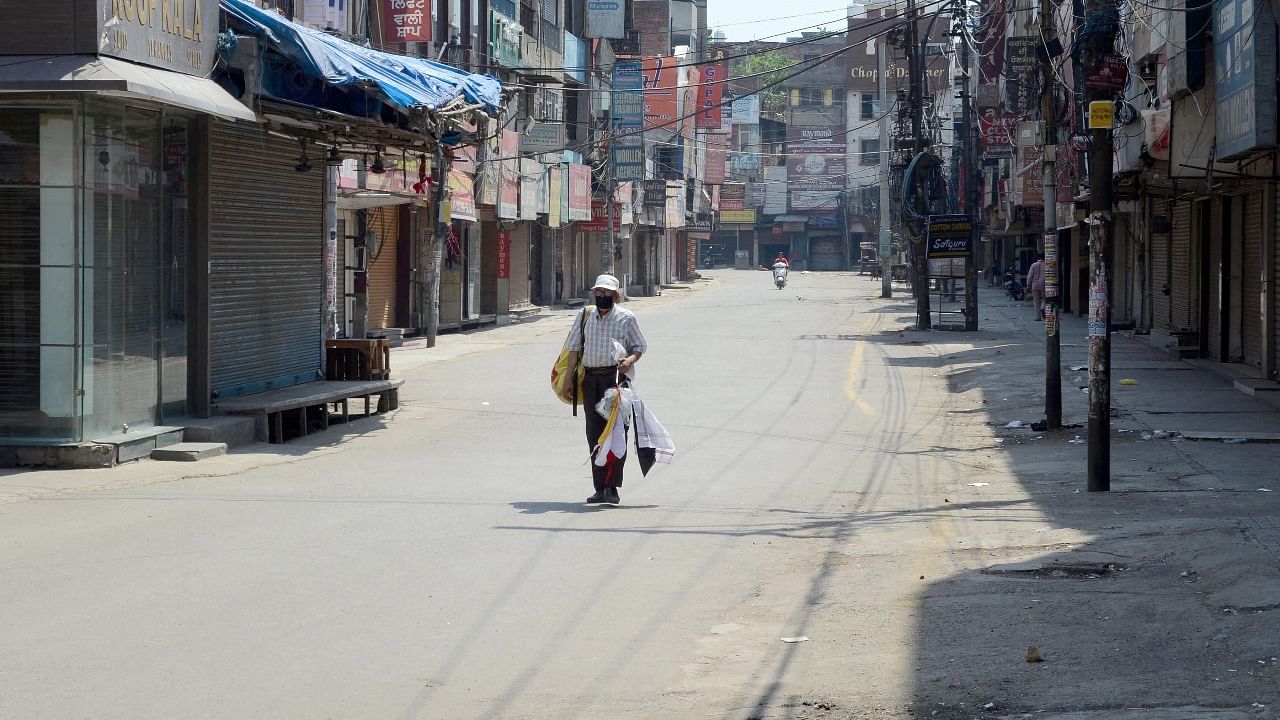 Deserted view of a market during Covid-induced lockdown, in Amritsar. Credit: PTI Photo