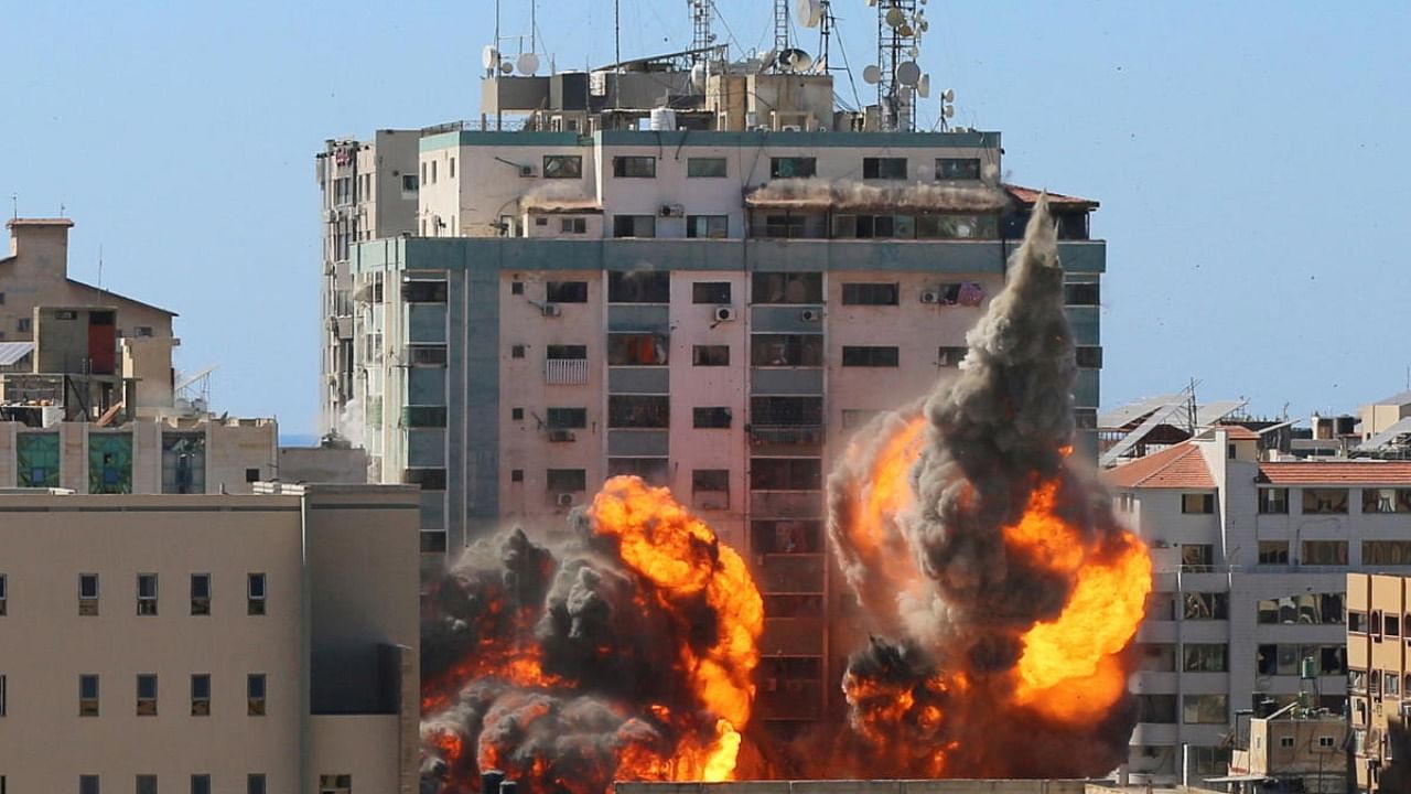 The al-Jalaa building housing Associated Press (AP) and Al Jazeera media offices is hit by an Israeli air strike in Gaza City. Credit: Reuters Photo