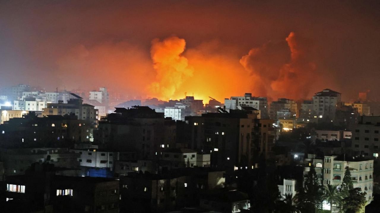 Fire erupts from the Andalus Tower as it is destroyed by an Israeli airstrike in Gaza City, controlled by the Palestinian Hamas movement. Credit: AFP Photo