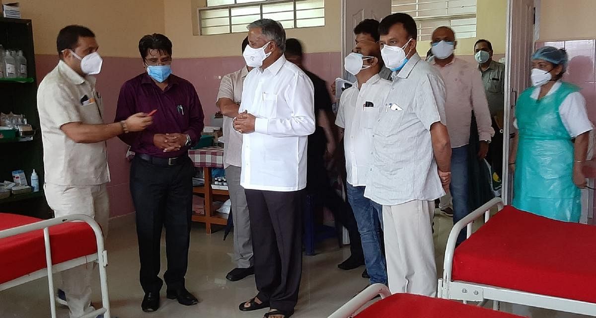 District In-charge Minister V Somanna inspects the taluk hospital in Virajpet.