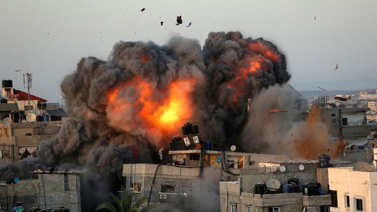 A ball of fire erupts from a building in Gaza City's Rimal residential district on May 16, 2021, during massive Israeli bombardment on the Hamas-controlled enclave. Credit: AFP Photo