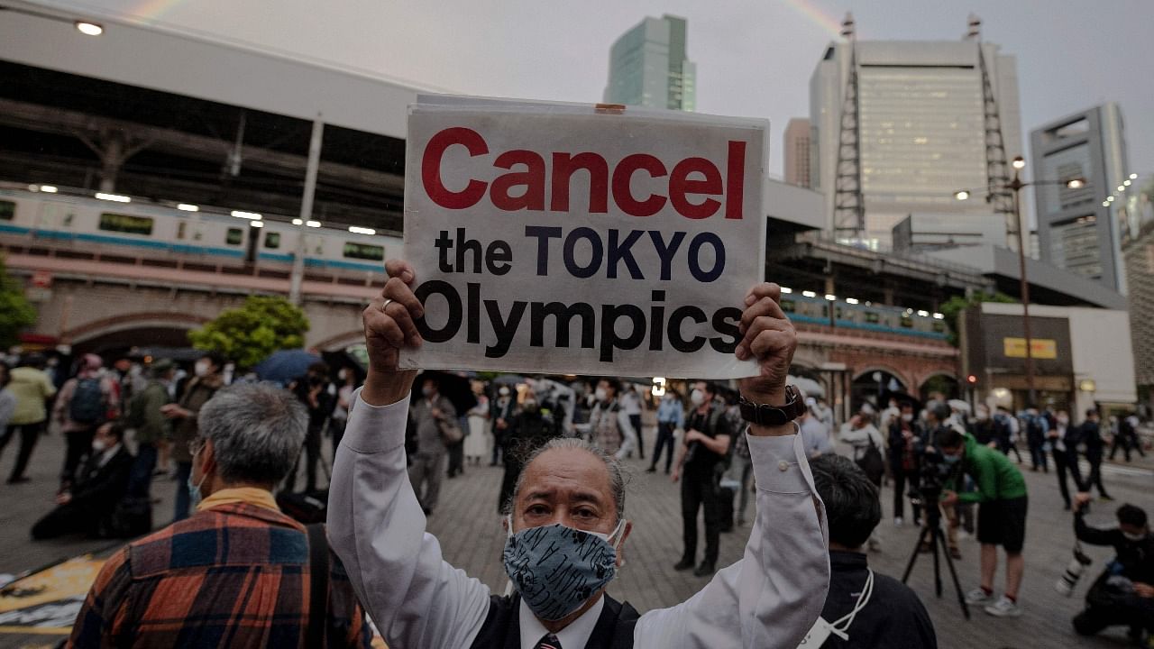 People take part in a protest against the hosting of the 2020 Tokyo Olympic Games in Tokyo. Credit: AFP Photo