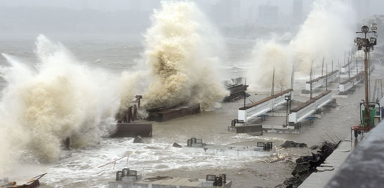 Waves lash over onto a shoreline in Mumbai. Credit: AFP Photo
