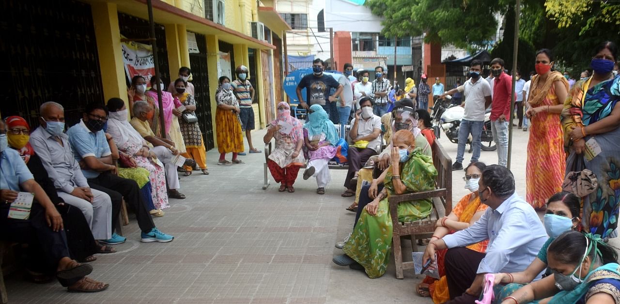 Beneficiaries wait in long queues for vaccination. Credit: PTI Photo