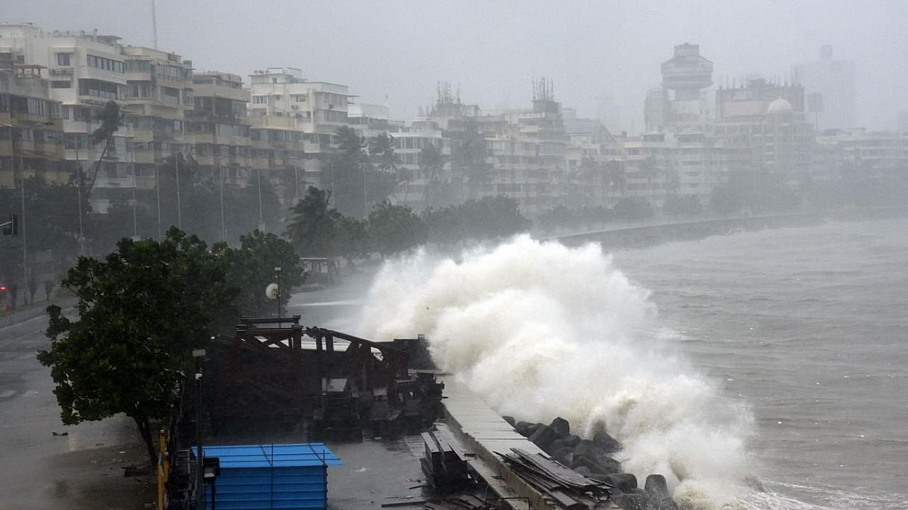 Waves lash over onto a shoreline in Mumbai on May 17, 2021, as Cyclone Tauktae, packing ferocious winds and threatening a destructive storm. Credit: AFP Photo