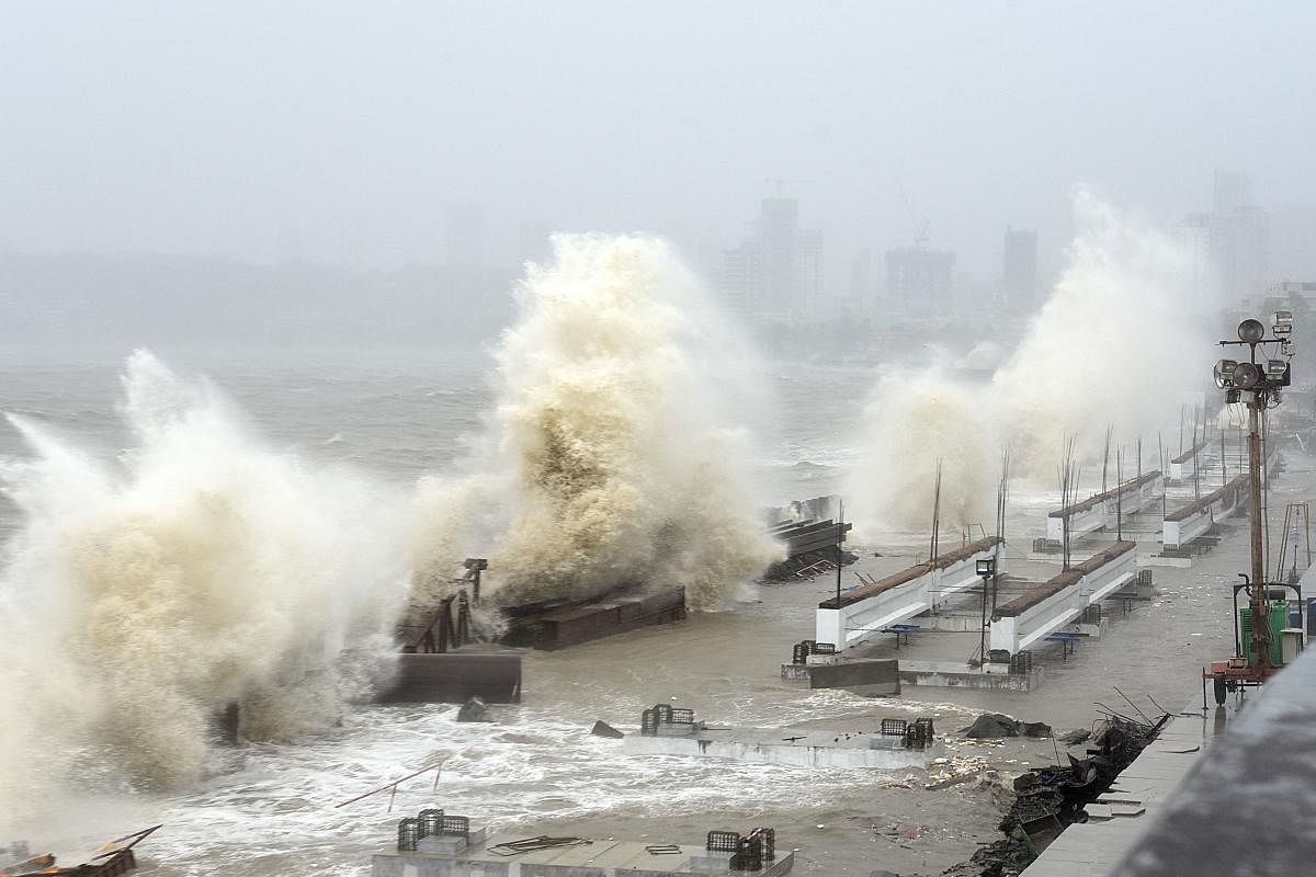 Waves lash over onto a shoreline in Mumbai. Credit: AFP Photo