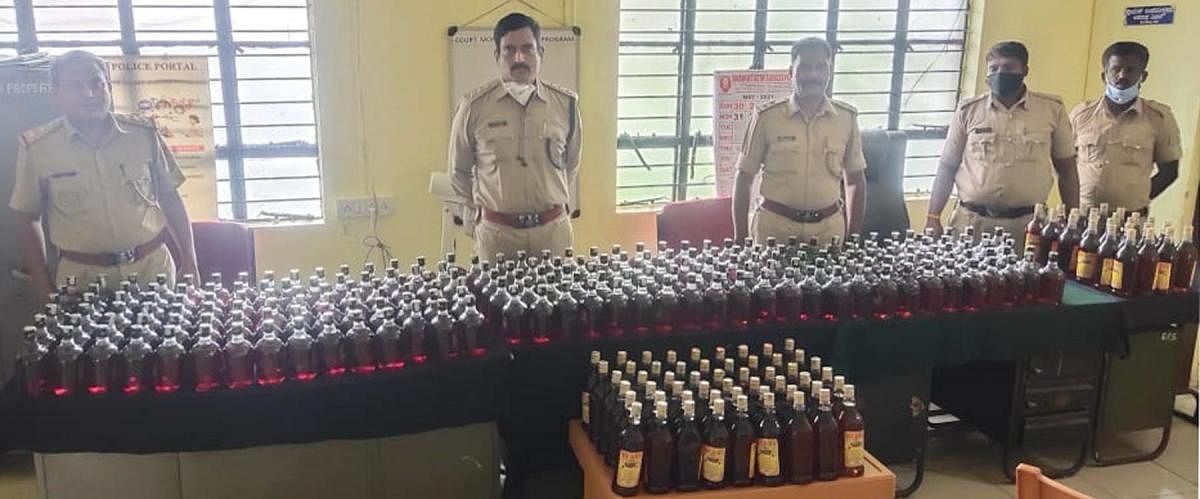 Gonikoppa police recovered liquor bottles from the truck.