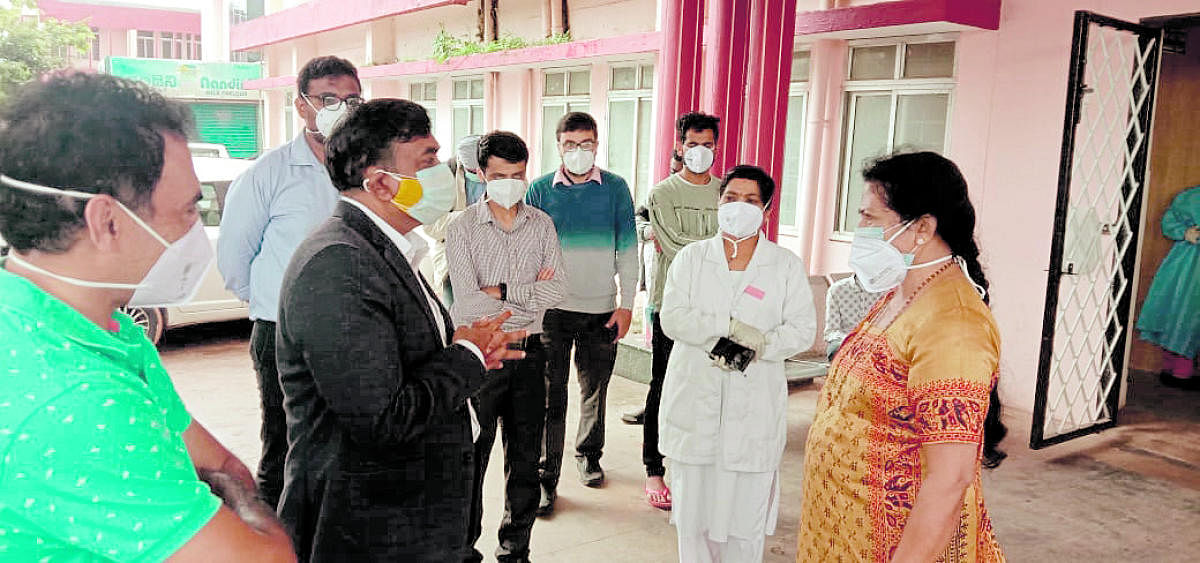MLC Veena Achaiah carries out a discussion with the authorities of the Designated Covid-19 Hospital in Madikeri on Monday.