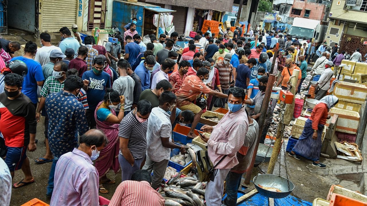 People visit a crowded market during relaxation hours from Covid-induced lockdown, in Hyderabad. Credit: PTI Photo