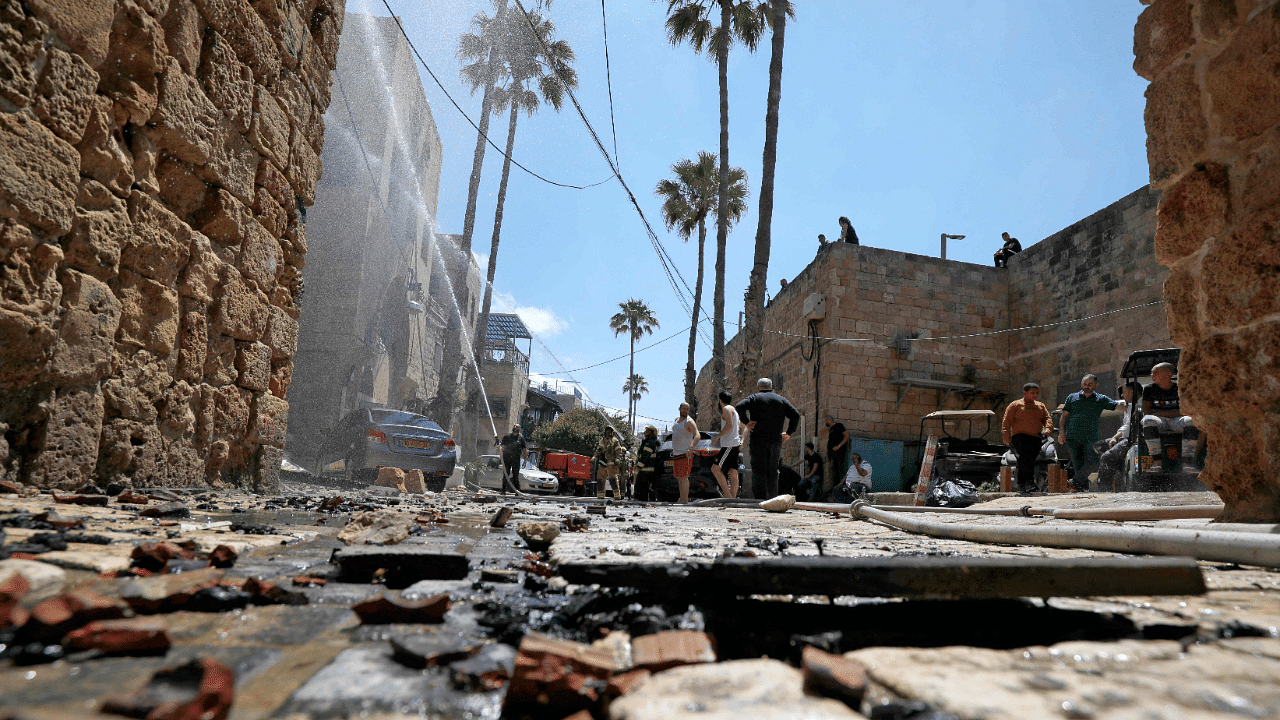 Israel bombed the coastal territory of Gaza, Palestinian militants there launched rockets at Israel, and Arab and Jewish mobs faced off in Israeli cities. Credit: AFP Photo