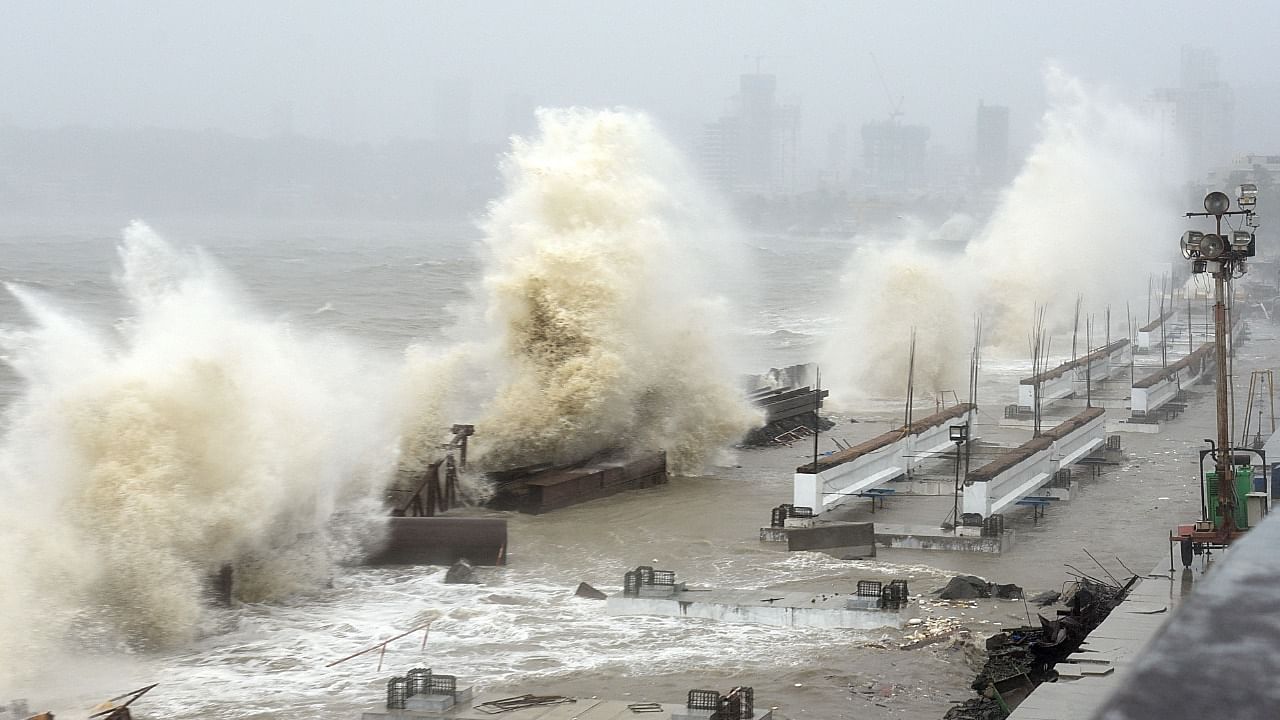 Waves lash over onto a shoreline in Mumbai on May 17, 2021, as Cyclone Tauktae, packing ferocious winds and threatening a destructive storm, surge bore down on India, disrupting the country's response to its devastating Covid-19 outbreak. Credit: AFP Photo