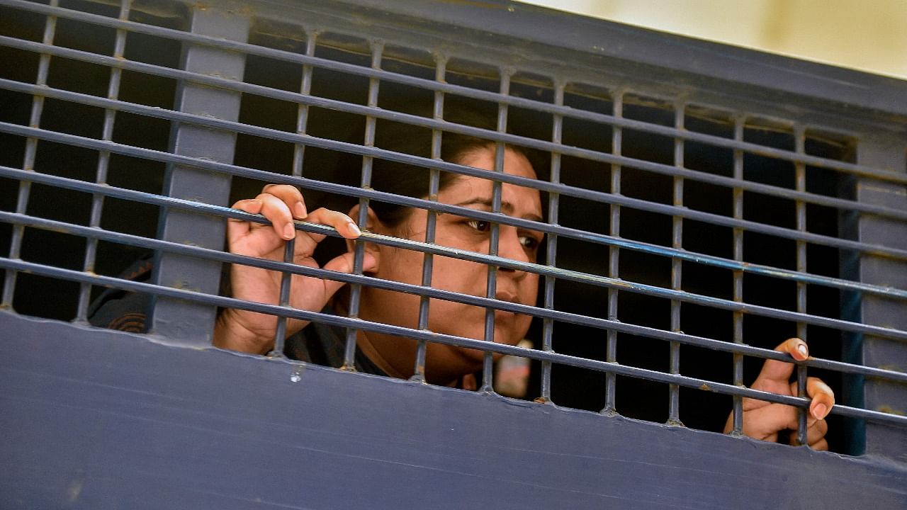 Investigative journalist Rozina Islam is seen inside a prison van in Dhaka on May 18, 2021, a day after being arrested on accusation of stealing documents and taking images by the health ministry. Credit: AFP Photo