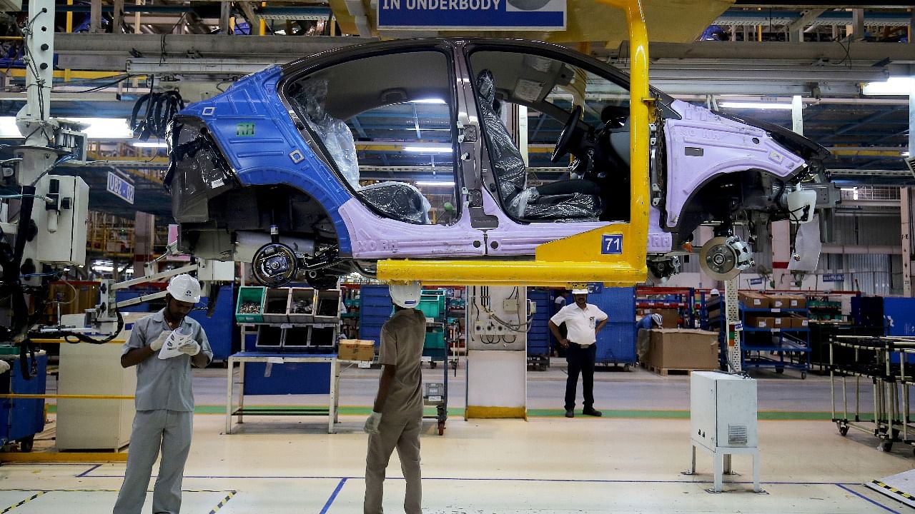 Workers assemble a Tata Tigor car inside the Tata Motors car plant in Sanand, on the outskirts of Ahmedabad. Credit: Reuters file photo