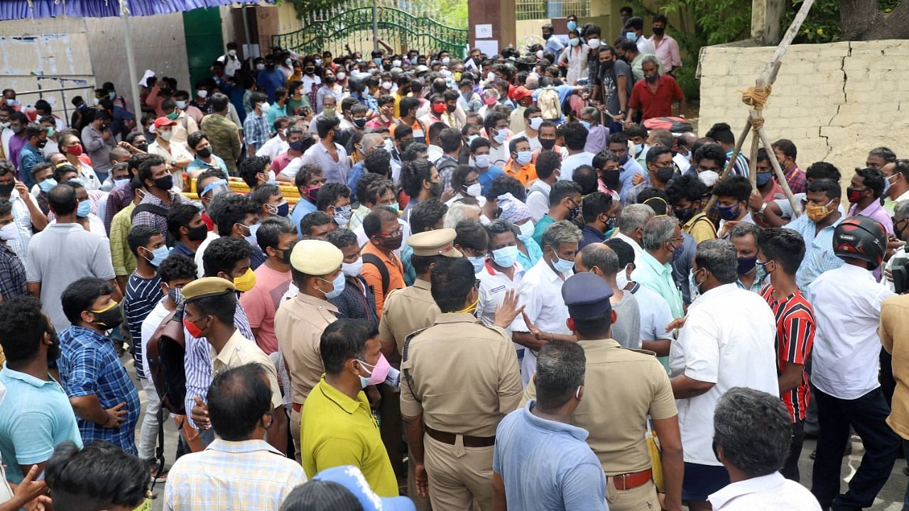 People wait to purchase Remdesivir, an antiviral drug used to treat Covid-19 symptoms, outside Nehru Stadium in Chennai. Credit: PTI Photo