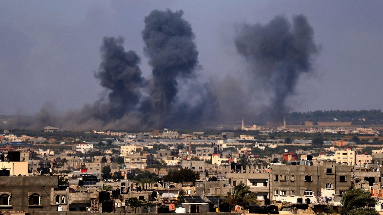Smoke billows following Israeli airstrikes on Rafah in the southern Gaza Strip on May 19, 2021. Credit: AFP Photo