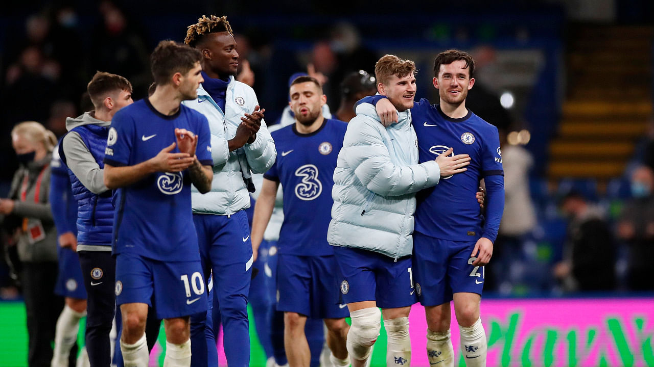 Chelsea players applaud fans during a lap of appreciation after the match, as a limited number of fans are permitted at outdoor sports venues. Credit: Reuters Photo