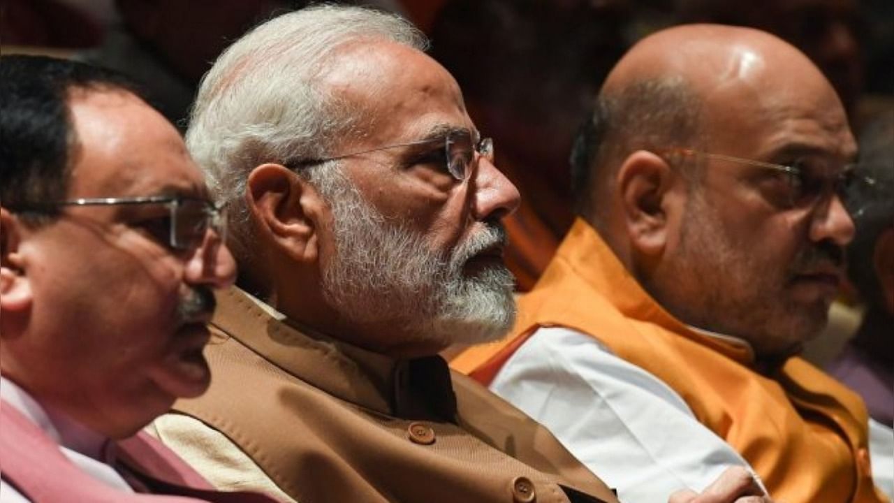 Prime Minister Narendra Modi, BJP working president JP Nadda and Home Minister Amit Shah. Credit: AFP Photo