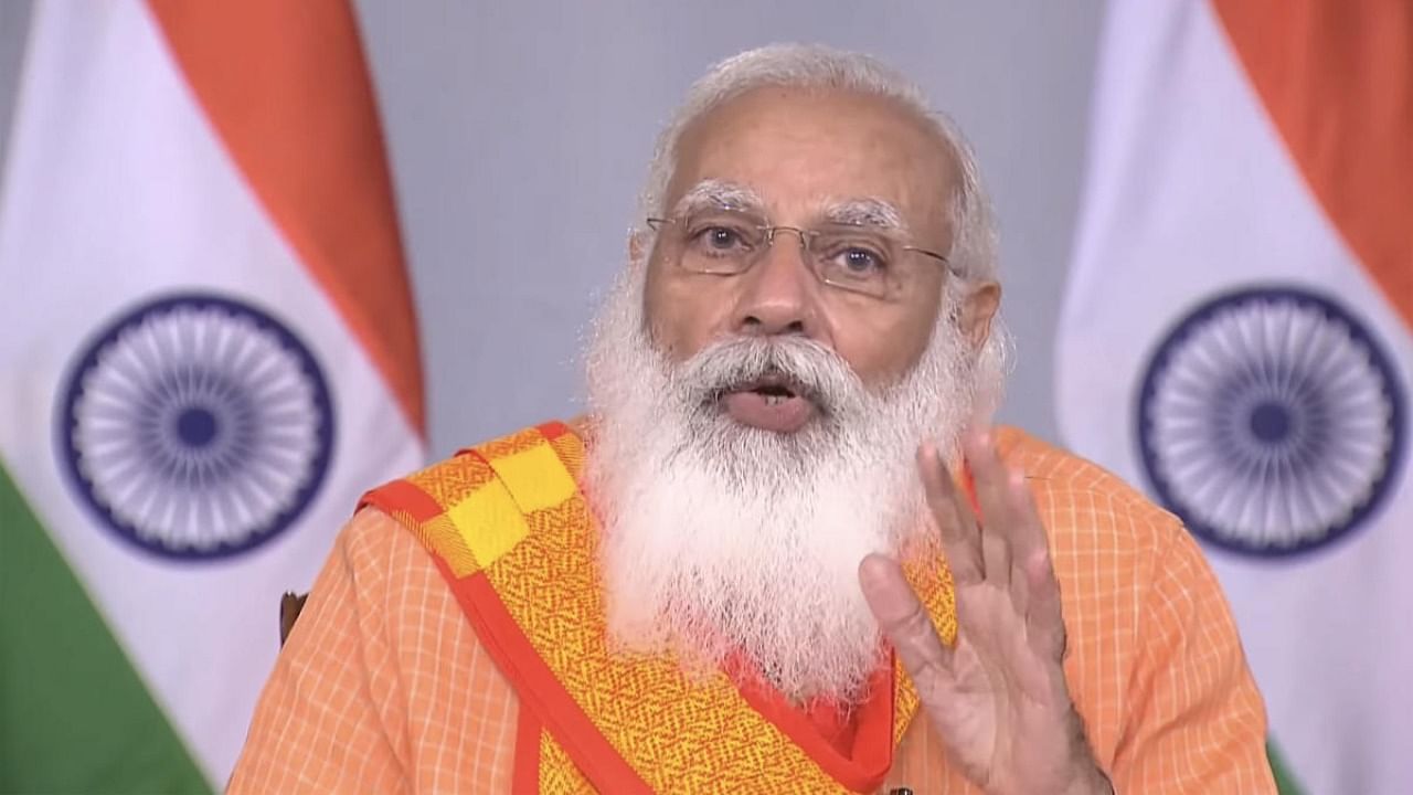  Prime Minister Narendra Modi interacts the doctors and frontline workers on Covid-19 situation in Kashi. Credit: PTI Photo