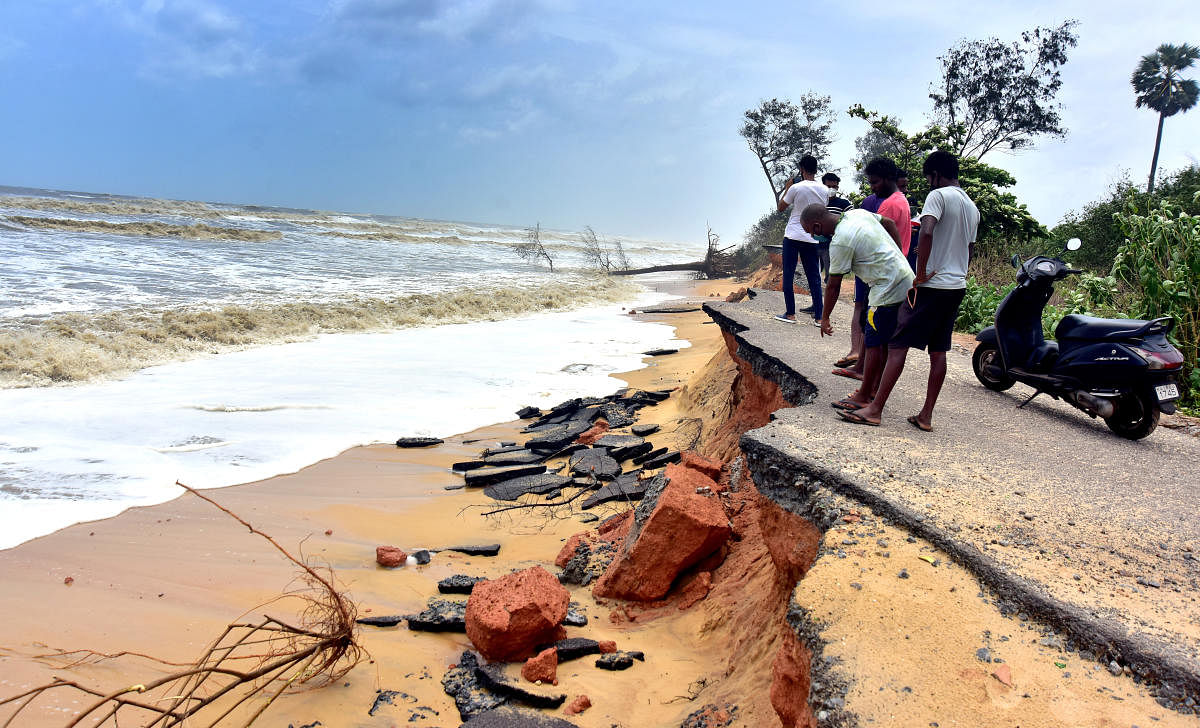 The NITK Beach Road was damaged in the fury of the waves at Surathkal. DH Photos/Govindraj Javali