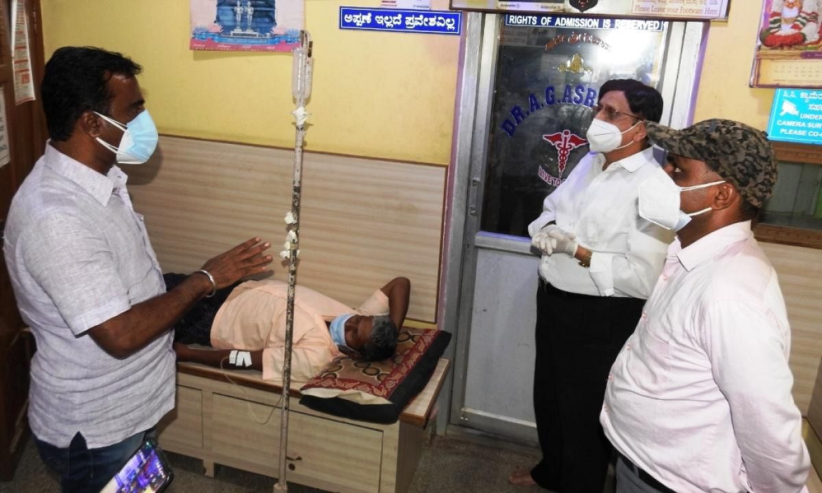 Taluk Health Officer Dr Arvind at a private clinic in Pandavapura, Mandya district, on Friday. DH Photo