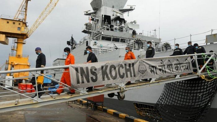 People who were stranded at sea aboard Barge P305 due to Cyclone Tauktae exit the Indian Naval Ship (INS) Kochi after they were rescued by the Indian Navy, at Naval Dockyard, Mumbai, India, May 19, 2021. Credit: Reuters Photo