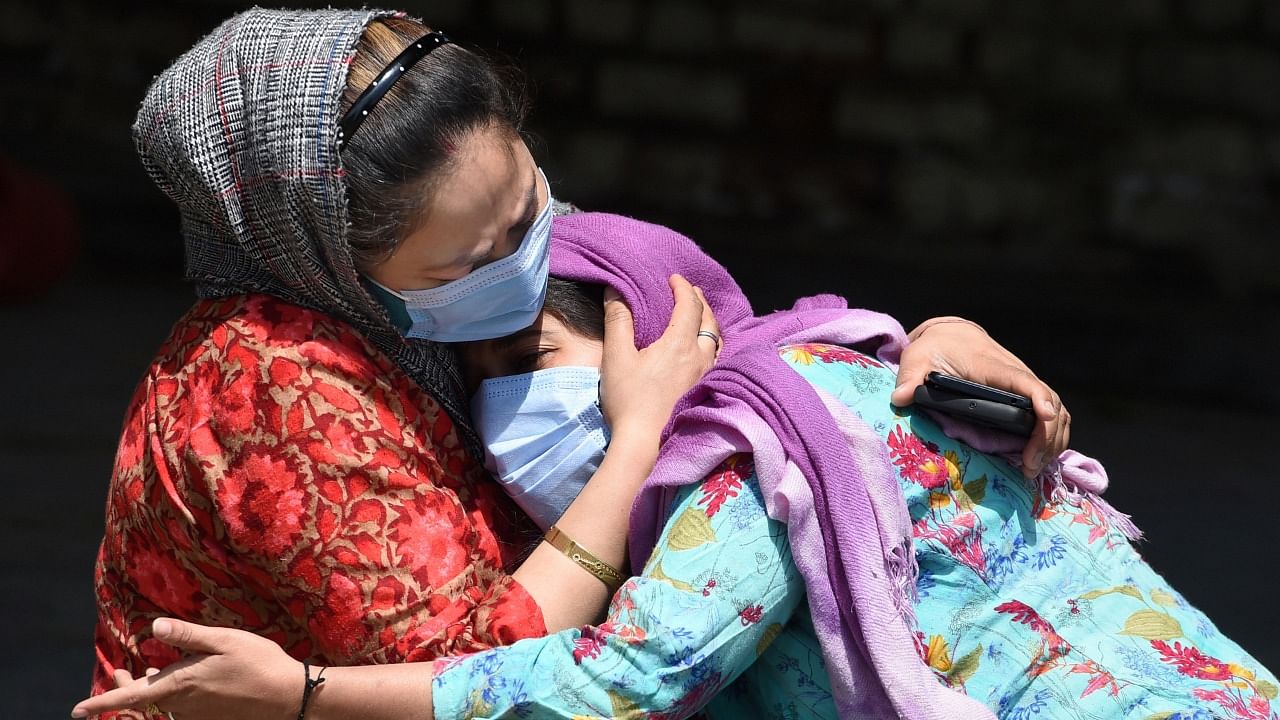 Women mourn the death of a family member, who died due to Covid-19, in Srinagar, Monday, May 17, 2021. Credit: PTI Photo