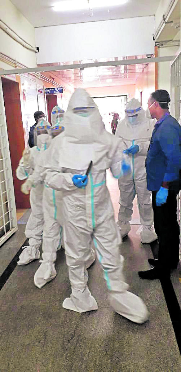 Deputy Commissioner Charulata Somal, wearing a PPE kit, pays a surprise visit to the Designated Covid-19 Hospital in Madikeri on Friday.