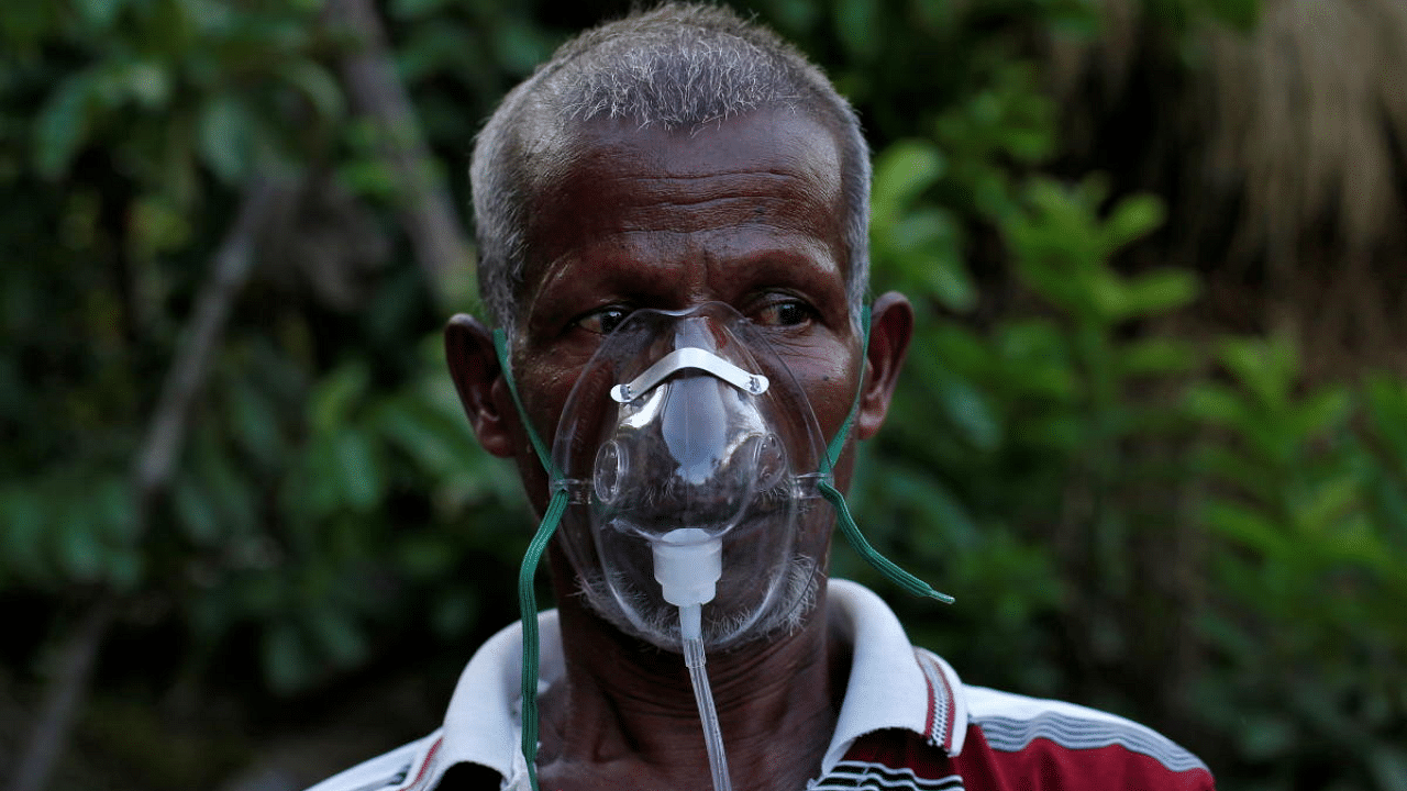 A villager receives oxygen support in West Bengal. Credit: Reuters Photo