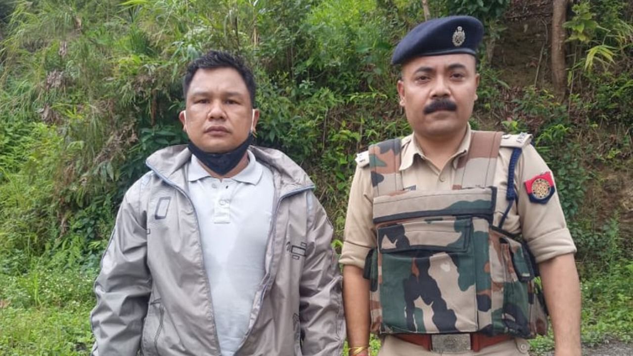 Ritul Saikia (left) after being released by the Ulfa-I militants. Credit: Twitter/@himantabiswa