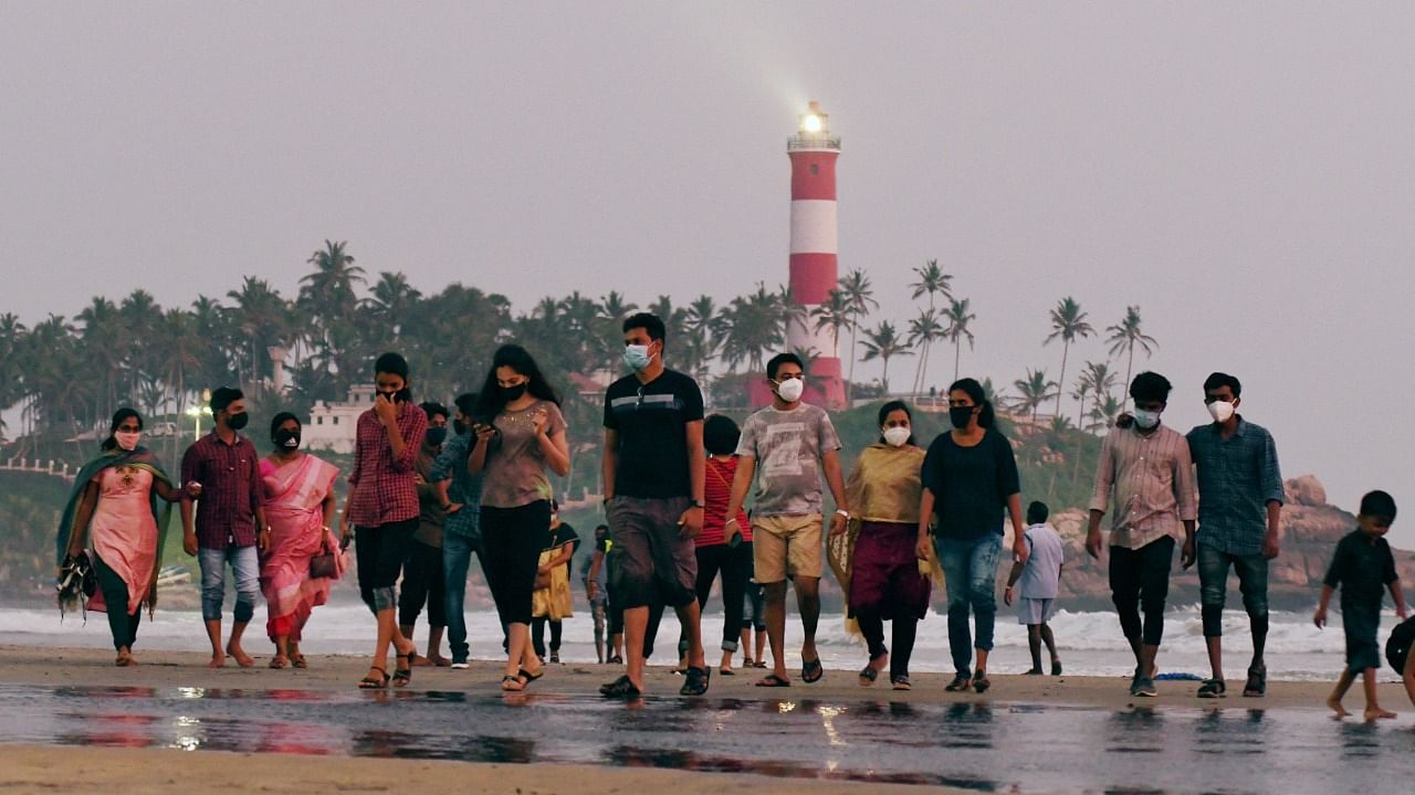 Tourists visit the popular Kovalam beach in Kovalam, Kerala. Credit: PTI File Photo