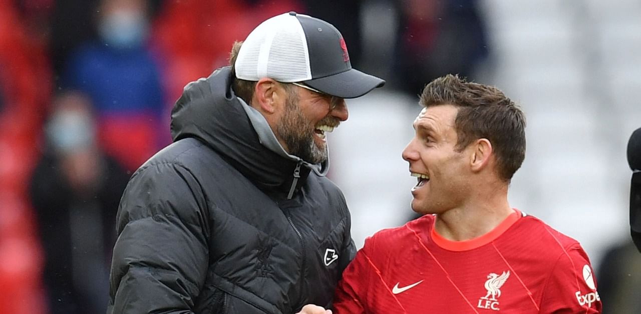 Liverpool manager Juergen Klopp celebrates with James Milner. Credit: Reuters Photo