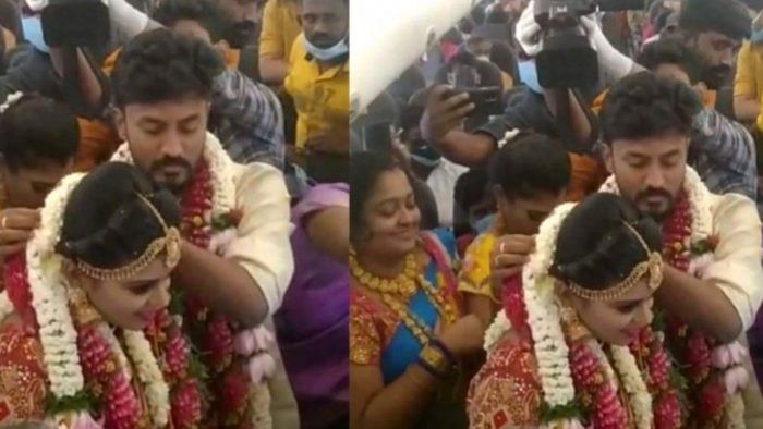 A mid-air wedding in the presence of guests and relatives took place inside a SpiceJet chartered flight on May 23. Credit: ANI Screengrab