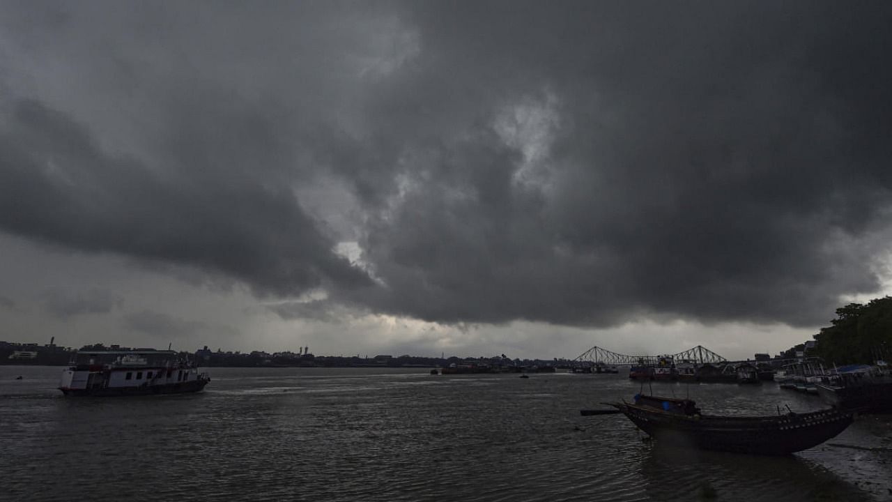 Dark clouds hover over River Ganga ahead of cyclone Yaas in Kolkata, Monday, May 24, 2021. Credit: PTI Photo