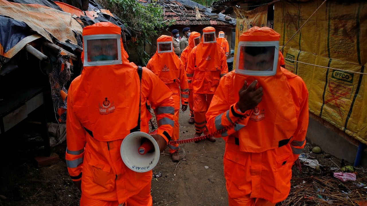 Members of the National Disaster Response Force (NDRF) use a megaphone to appeal to residents to move to safer place ahead of Cyclone Yaas at Digha in Purba Medinipur district in the eastern state of West Bengal, India, May 25, 2021. Credit: Reuters Photo