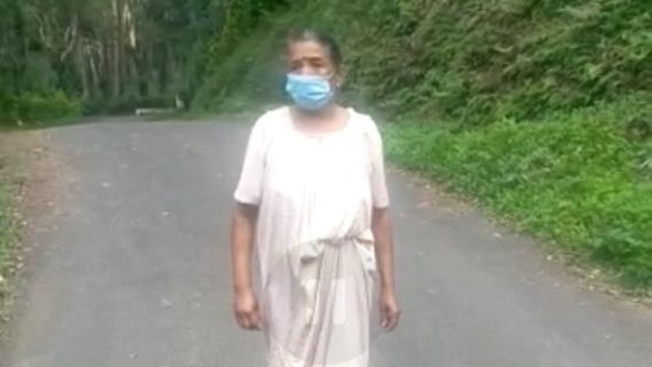 Ponnamma, who was discharged from the hospital, walks towards her house, near Kiraganduru. Credit: special arrangement