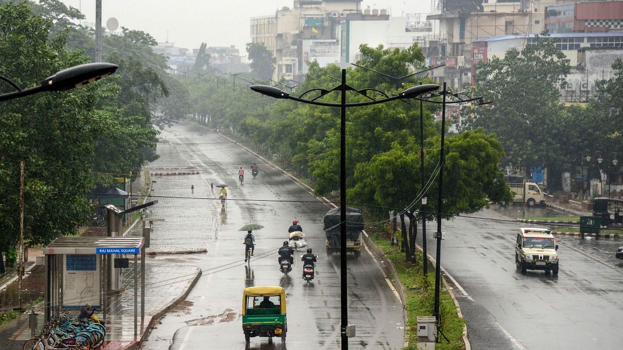 Vehicles ply during rain triggered by Cyclone Yaas, in Bhubaneswar, Tuesday, May 25, 2021. Credit: PTI Photo