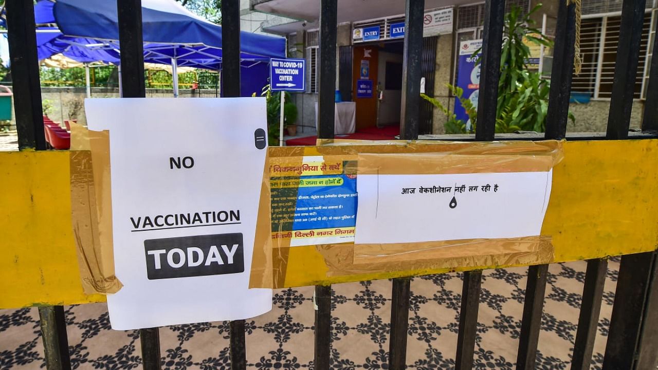 A notice outside a vaccination centre states non-availability of vaccines against the Covid-19 disease, in New Delhi. Credit: PTI Photo