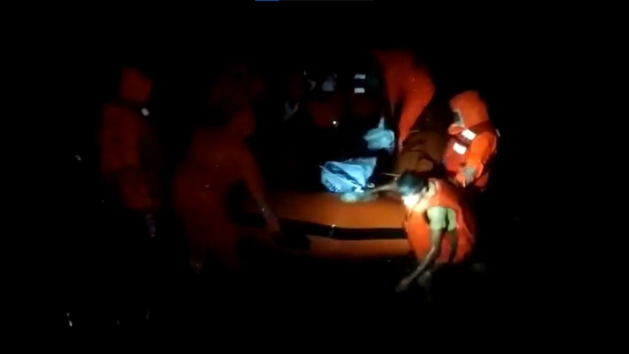 In a video tweeted by the Jagatsinghpur district collector, rescue personnel on Tuesday night can be seen holding on to an inflatable boat as people disembarked. Credit: Screengrab via Twitter/@Naveen_Odisha