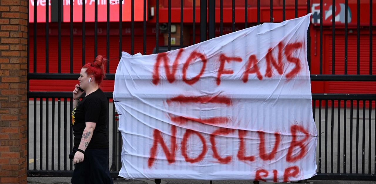A banner critical of the Super League hangs at the Anfield stadium. Credit: AFP File Photo