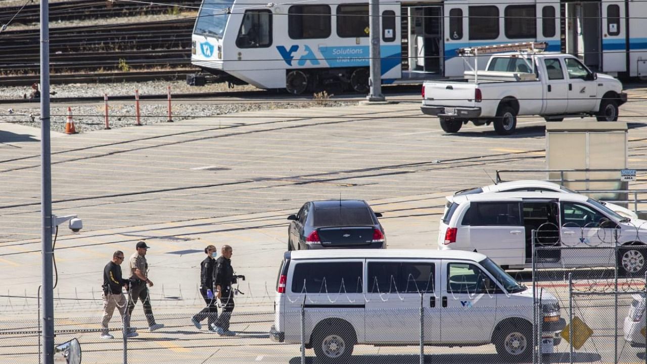 Investigators work the scene near the site where a mass shooting at the Valley Transportation Authority (VTA) light-rail yard on May 26, 2021 in San Jose, California. Credit: AFP Photo