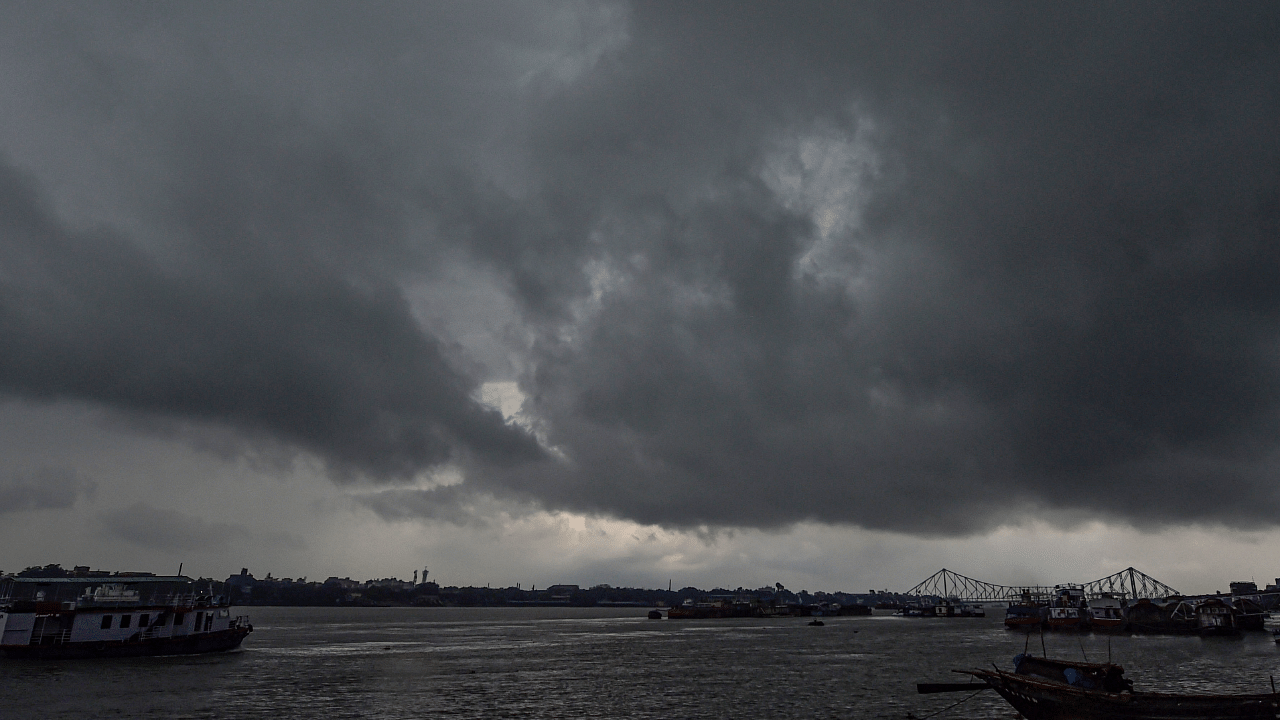 Dark clouds hover over River Ganga ahead of cyclone Yaas in Kolkata. Credit: PTI Photo