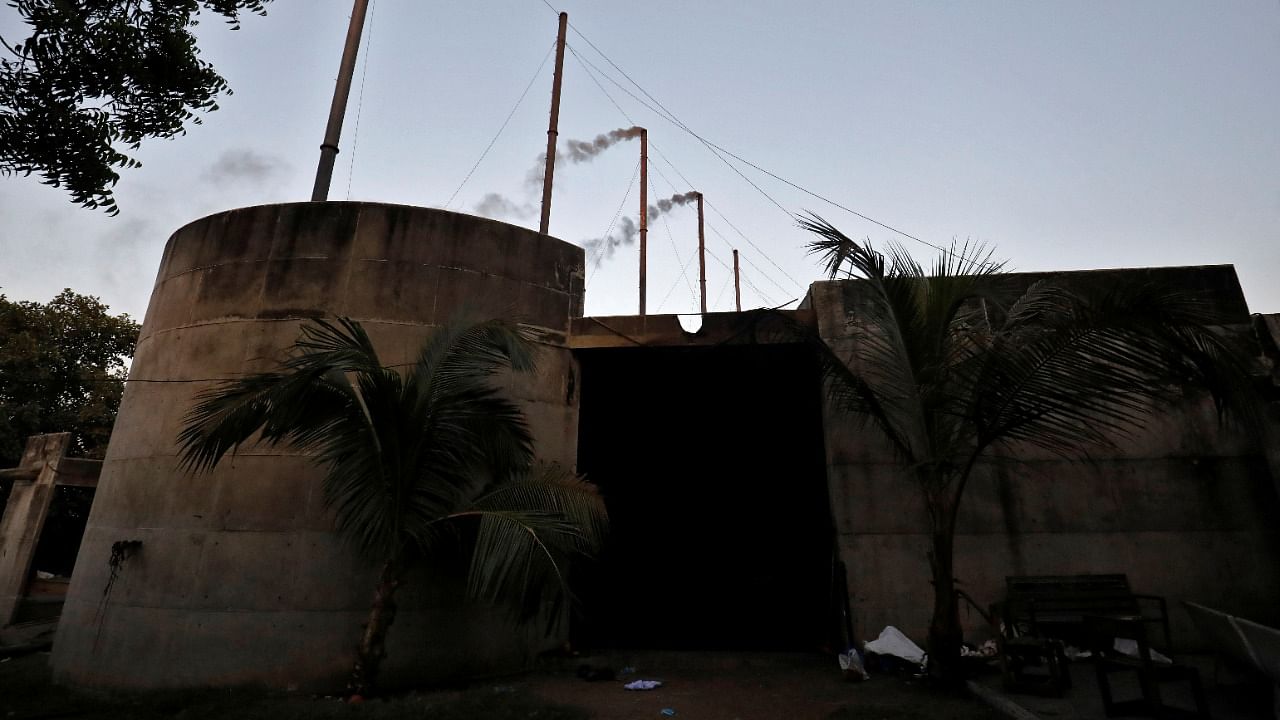 Smoke come out from the chimneys of the Ashvinikumar crematorium where people who died from the coronavirus are cremated in Surat, India, May 11, 2021. Credit: Reuters Photo