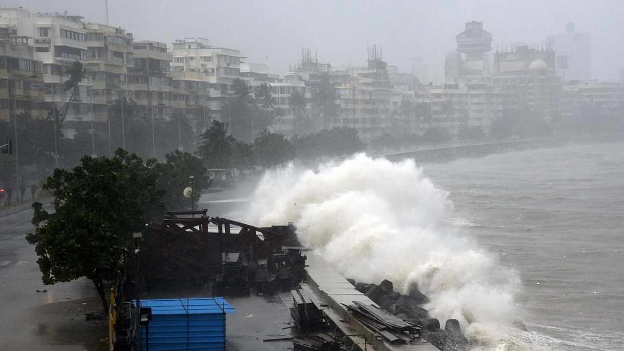 Waves lash over onto a shoreline in Mumbai. Credit: AFP Photo