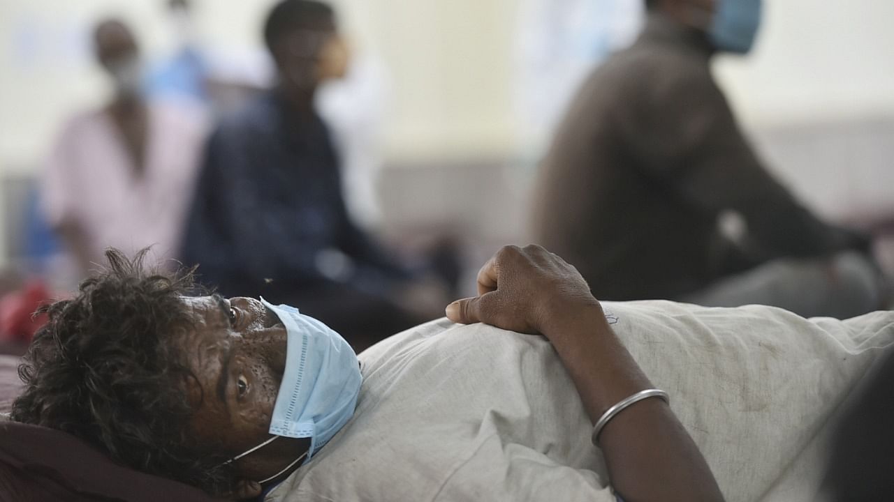 A homeless Covid-19 patient receives treatment at an isolation ward facility of a Covid-19 care centre, in New Delhi. Friday, May 28, 2021. Credit: PTI Photo