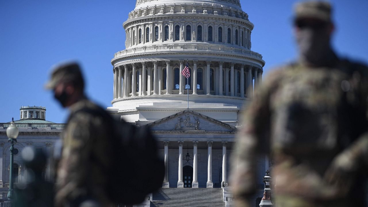 In this file photo taken on March 03, 2021 members of the National Guard are seen patrolling near the US Capitol Building on Capitol Hill in Washington, DC. Credit: AFP Photo