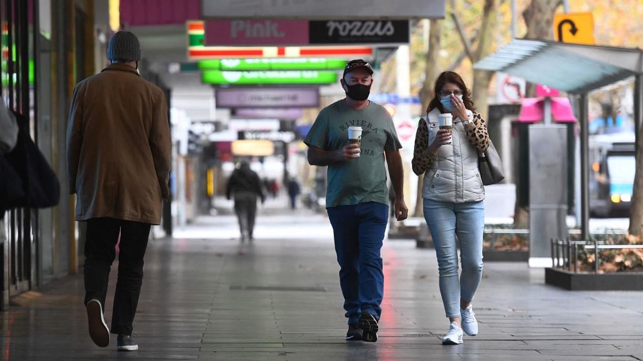 People walk down a usually busy street in the central business district in Melbourne on May 28, 2021, as the city's residents returned to a seven-day lockdown. Credit: AFP Photo