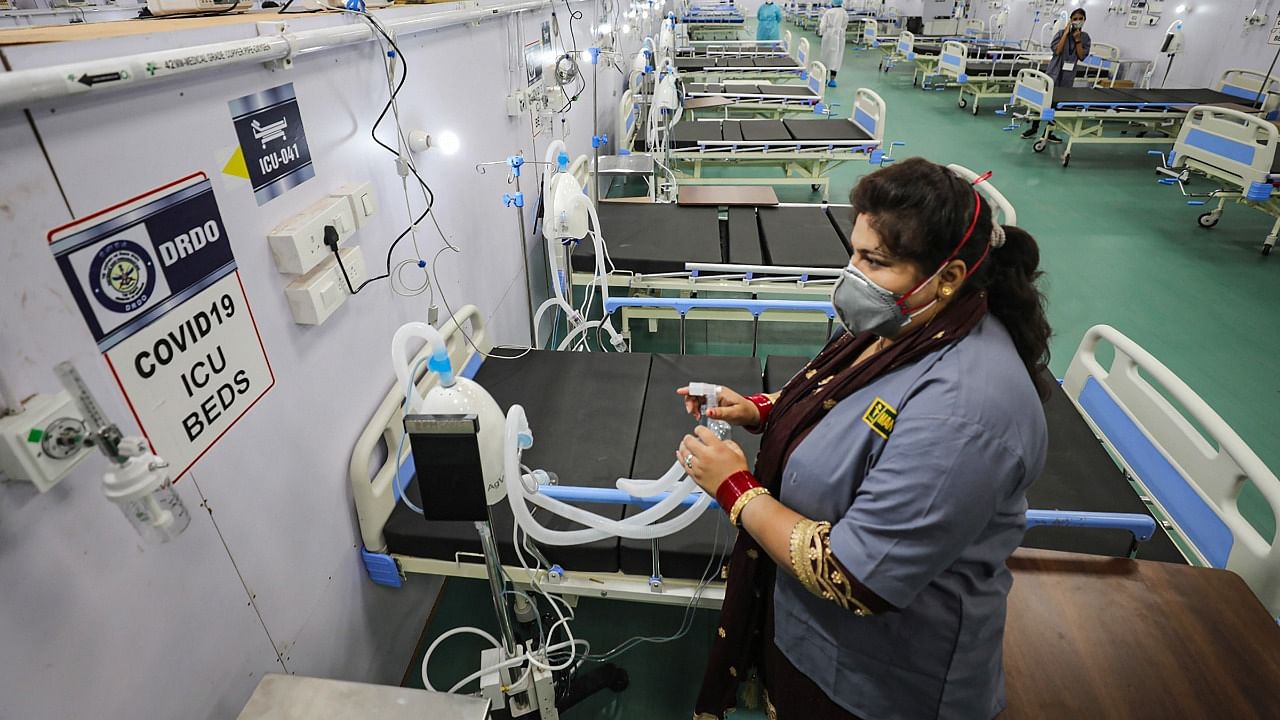 A woman worker at the newly inaugurated 500-bedded Covid-19 hospital, prepared by the DRDO, at Bhagwati Nagar in Jammu, Saturday, May 29, 2021. Credit: PTI Photo