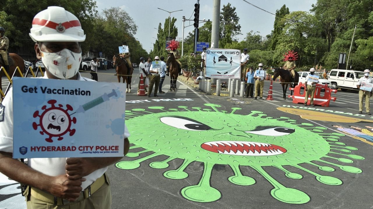 A painting of coronavirus on a road to create public awareness against the Covid-19, in Hyderabad, Saturday, May 29, 2021. Credit: PTI Photo