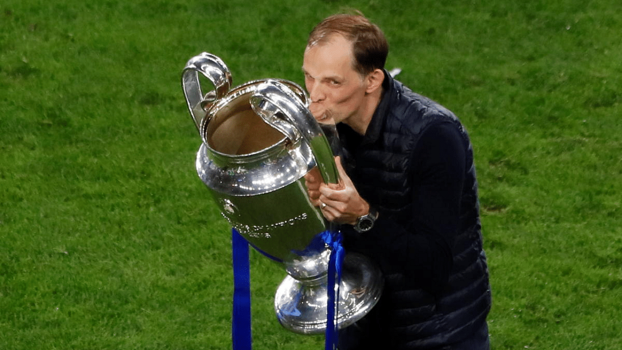 Chelsea manager Thomas Tuchel celebrates with the trophy after winning the Champions League. Credit: Reuters Photo
